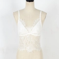 Detailed close-up of white floral lace camisole with delicate eyelash trim on V-neckline - S / White