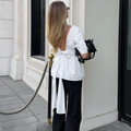 Elegante witte top met open rug voorzien van een grote decoratieve strik en lange linten - S / Wit