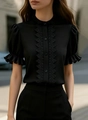 Close-up of black lace patchwork and puff sleeves on the elegant stand collar shirt - S / Tops / Black