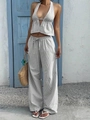 Detail von grau gestreiftem Neckholder-Top und weit geschnittener Hose mit Kordelzug - S / Grau