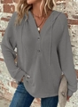 Detail shot of grey waffle knit fabric texture on hooded sweatshirt with v-neck and buttons - S / Gray
