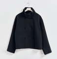Detail of elegant black wool coat with high stand collar and double-breasted buttons - S / Tops / Black