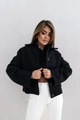 Detail shot of a black button-down crop jacket with lapels and loose silhouette design - S / Tops / Black