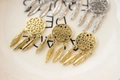 Macro detail of 14K gold plated dreamcatcher pendant with delicate feather charms for DIY jewelry - 14K Gold Dreamcatcher