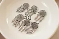 Detailed view of six silver dreamcatcher charms with feathers for DIY jewelry making - White Gold Color Dreamcatcher