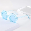 Detailed view of light blue translucent shell shaped kids sunglasses with glitter frame - Crystal Blue