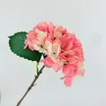 Detailed view of dark pink artificial hydrangea with gradient petals and green leaf - Deep Pink