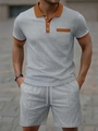 Detailed close-up of waffle knit texture and contrast orange trim on light grey men polo set - S / Gray