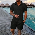 Detail of men's summer resort set showing waffle textured fabric and buttoned shirt - S / Black