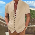 Detail of men's beige cotton linen shirt featuring a mandarin collar and decorative buttons - S / Khaki