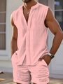 Détail macro de l'ensemble d'été rose pour hommes montrant le tissu gaufré texturé - S / Rose