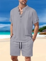 Close-up of gray cotton linen short sleeve Henley shirt with buttoned roll-up sleeves - S / Top And Bottom / Gray