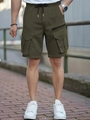 Detail of olive green cargo shorts featuring elastic waist, black drawstring and side pockets - S / Army Green