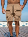 Detail of khaki cargo shorts featuring multiple zip pockets and adjustable drawstring waist - S / Khaki