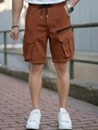 Detail of men's cargo shorts with elastic waist and metal-tipped drawstring in ochre - S / Dark Brown