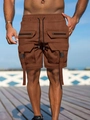 Detail of caramel cargo shorts featuring adjustable waist drawstrings and zippered pockets - S / Dark Brown