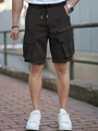 Detailed view of elastic drawstring waist and large cargo pockets on men's outdoor shorts - S / Black
