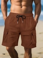 Detail of coffee brown cargo shorts with elastic drawstring waist and large side pockets - S / Dark Brown