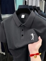 Detail of grey men's polo shirt showing waffle texture fabric and golf logo embroidery - S / Gray
