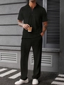 Close-up of black jacquard knit men's polo set with zipper and textured diamond pattern - S / Black
