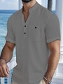 Detail of grey cotton linen Henley shirt showing stand-up collar and button chest pocket - S / Gray