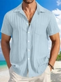 Detail of light blue linen striped shirt texture with chest pocket on beach background - Light Blue