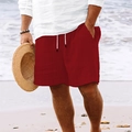 Men's dark red striped beach shorts with white drawstring waist on a sunny beach - S / Burgundy