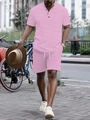Detail of pink men's summer set featuring white geometric patterns and Henley neckline - S / Pink