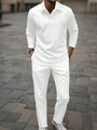 Dettaglio ravvicinato della trama geometrica a maglia bianca del set polo da uomo a due pezzi - S / Bianco