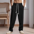 Men's black linen drawstring trousers featuring a relaxed fit for beach and casual wear - S / Black
