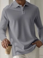 Detailed view of dark gray men's polo shirt featuring waffle knit texture and three-button collar - S / Gray Jacquard