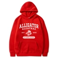 Detailed view of red hoodie with Alligator Alcatraz graphic and kangaroo pocket design - Red