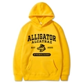 Detail of yellow hoodie featuring Alligator Alcatraz print and front kangaroo pocket - Yellow