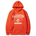 Vibrant orange long-sleeve hoodie featuring Alligator Alcatraz vintage graphic print - Orange Red