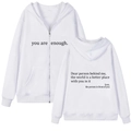 Detail view of white zip-up hoodie featuring motivational back text and kangaroo pockets - S / White