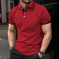 Close-up detail of red polo shirt collar with navy stripes and white buttons - S / Tops / Red
