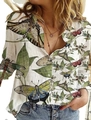 Detailed view of white long-sleeve shirt with vintage butterfly and botanical prints - S / Tops / Butterfly