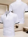 Vue détaillée du polo de golf blanc avec col et poignets contrastés noirs en maille - S / Blanc/Noir Bloc de Couleur