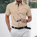 Detail of khaki short sleeve shirt featuring contrast black piping and button placket - S / Tops / Khaki