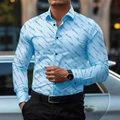 Detailed close-up of light blue men's shirt with geometric print and black buttons - S / Sky Blue