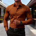Close-up of caramel brown long sleeve shirt featuring black Los Angeles chest print detail - S / Brown