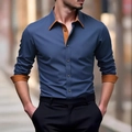 Détail d'une chemise bleu marine avec col et poignets contrastés orange au style élégant - S / Bleu