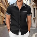 Detail of men's black short-sleeve shirt with houndstooth patchwork on pocket and collar - S / Tops / Black