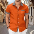 Detail of orange shirt showing houndstooth collar stitching and single chest pocket design - S / Tops / Orange