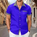 Close-up of royal blue short sleeve shirt with black and white houndstooth patchwork details - S / Tops / Sapphire Blue