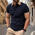 Detail of navy blue men's polo shirt featuring contrasting beige striped collar and cuffs - S / Tops / Navy Blue