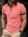 Close-up of coral pink slim fit polo shirt with black contrast collar and striped sleeve cuffs - M / Pink