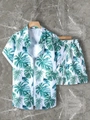 Close-up of tropical palm leaf print and elastic waistband on men's summer set - S / Top And Bottom / White Base Green Leaves (DS+29-Green)