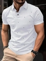 White short sleeve polo shirt for men featuring black geometric patterns and three buttons - S / White and Black Geometric Print (G32P457)