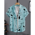 Dettaglio camicia azzurra a maniche corte con motivi neri astratti ed etichetta taglia M - S / Tops / Stampa Foglie Astratte Blu Chiaro (HD-DS909-Blu)